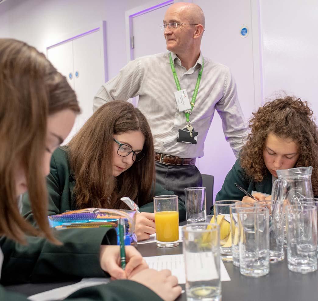 Students at Cracking the Code final event taking part in a Mathematics Magic activity delivered by Stand Up Maths