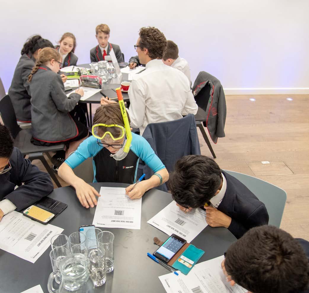 Students at Cracking the Code final event taking part in a Mathematics Magic activity delivered by Stand Up Maths