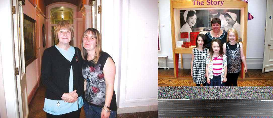 Two women in a hallway and a group in front of an exhibition display titled "The Story" with historical photos.