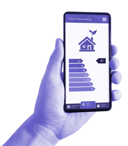 Hand holding a smartphone displaying a "Smart Home Energy" app with a house icon and energy efficiency ratings from A+ to F.
