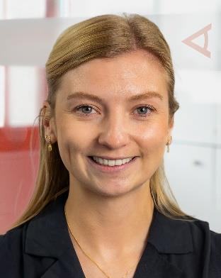 Headshot of a smiling woman with blonde hair, looking directly at the camera.