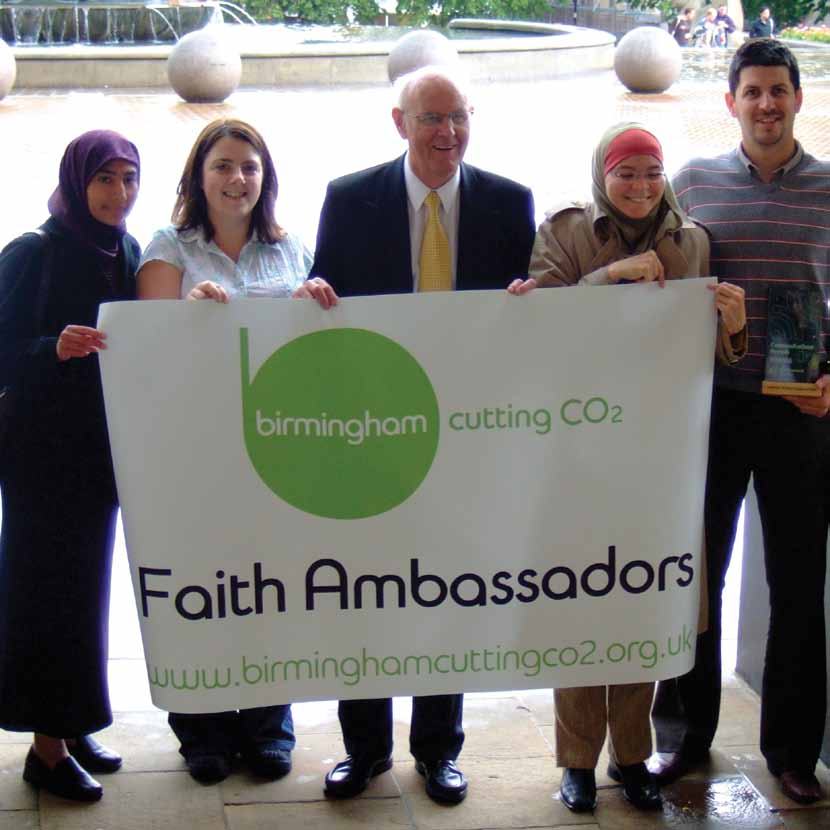 Five people holding a banner for "birmingham cutting CO2 Faith Ambassadors" with a website address.