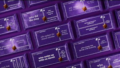 A flat lay of Cadbury Dairy Milk chocolate bars, each wrapper featuring a different question like "who did the shop" or "who woke up with no duvet", indicating a promotional campaign.