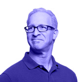 Headshot of a man with short gray hair and glasses looking to the side.
