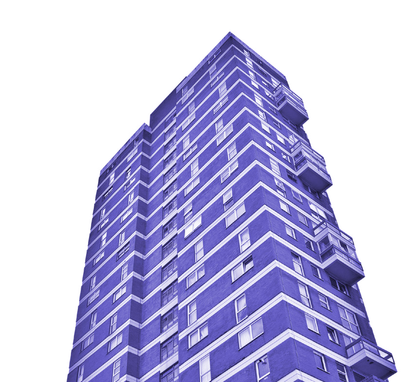 Low-angle view of a tall multi-story building with balconies.