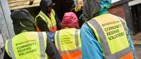 British Red Cross Community Reserve Volunteers in yellow vests, engaged in an activity.
