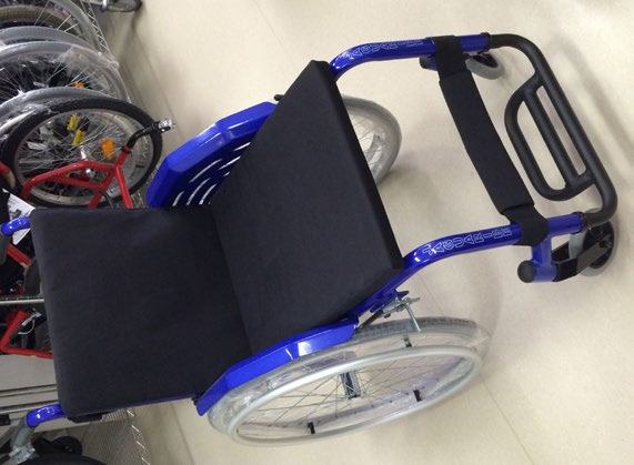 A blue, lightweight manual wheelchair with a black seat, shown from an angled top-down view.