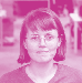 Headshot of a woman with short dark hair and glasses looking forward, tinted pink.