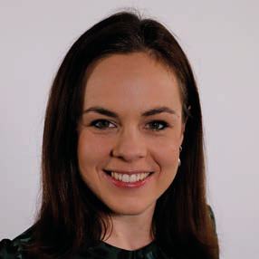 Headshot of a smiling woman with dark hair.