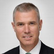 Professional headshot of a man.