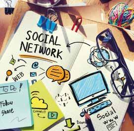 Flat lay showing a notebook titled "SOCIAL NETWORK" with hand-drawn icons and notes illustrating web, communication, and social media concepts.