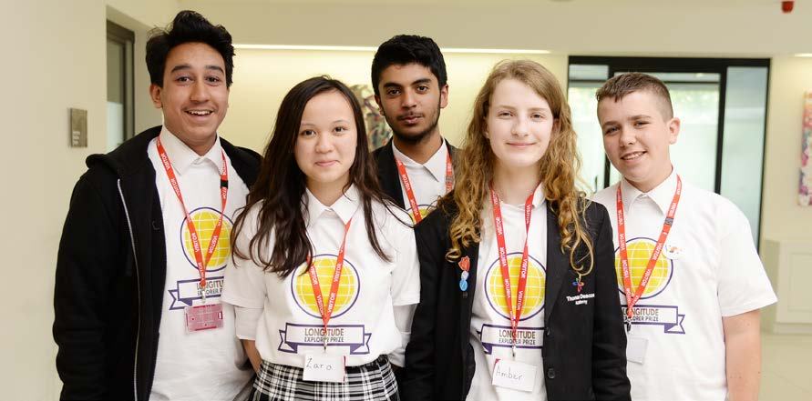 Five young people, participants of the Longitude Explorer Prize, smile at the camera.