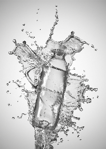 A water bottle surrounded by a dynamic splash of water, depicting liquid movement and the bottle's design.