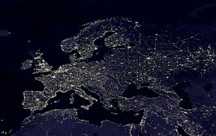 Map of Europe at night, highlighting illuminated urban areas and population distribution.