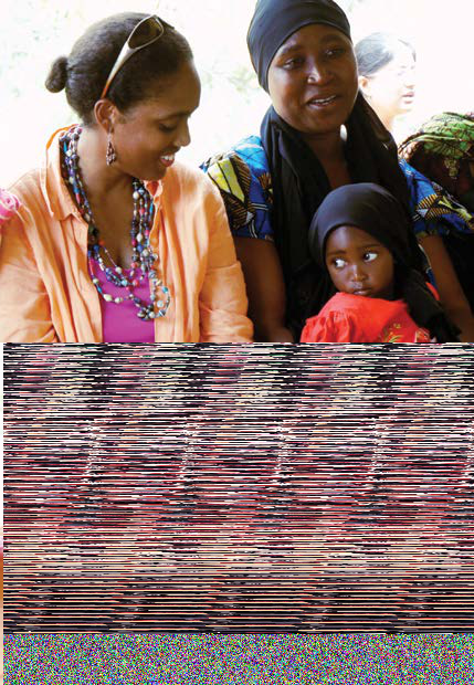 Two women and a young child, with the bottom half of the image corrupted by digital artifacts.