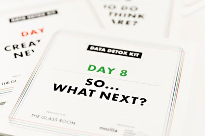 Close-up of several "DATA DETOX KIT" booklets, with the top one displaying "DAY 8 SO... WHAT NEXT?".