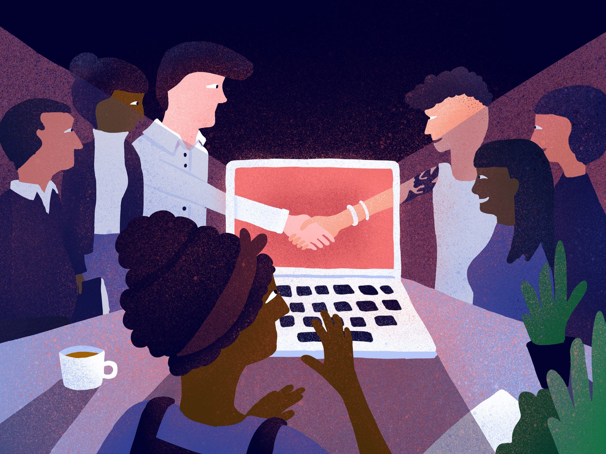 Diverse team collaborating around a laptop showing a virtual handshake, symbolizing digital agreement or partnership.