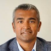 Professional headshot of a man.