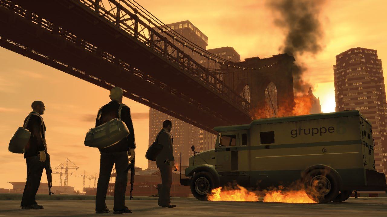 Three men in suits observe a burning armored "gruppe" truck under a bridge, with a city skyline in the background, likely from a video game.