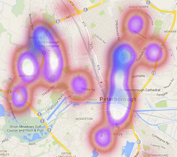 Heatmap showing areas of high and low intensity over a street map of Peterborough, highlighting key locations like the hospital and cathedral.