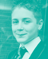 Portrait of a smiling student wearing a school uniform.