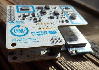 Close-up of a Smart Citizen Kit Urban Shield v1.1 circuit board, designed in Barcelona, with an Arduino logo.